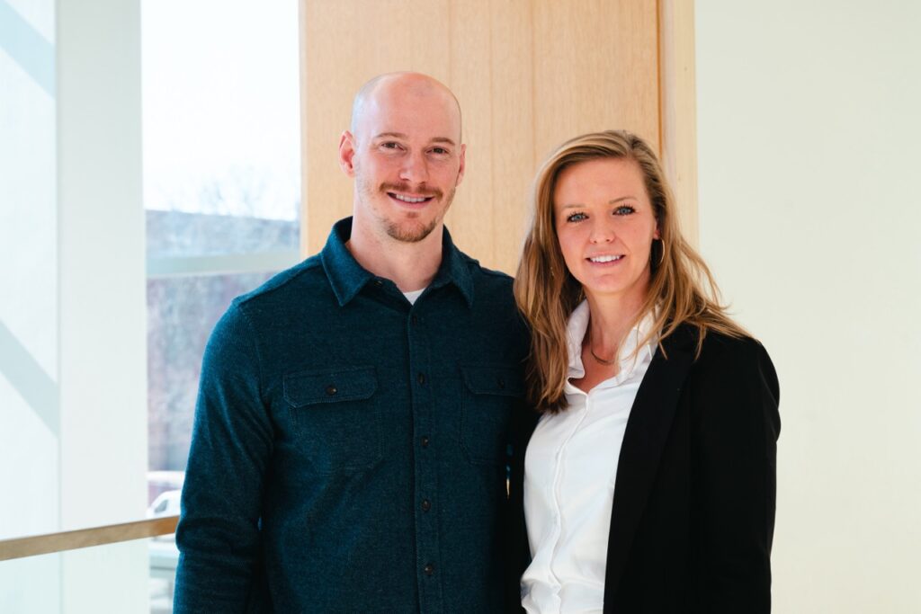 Grant and Erin Stahla with a student